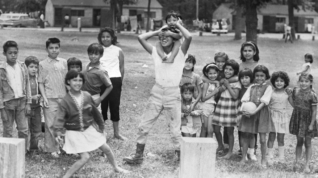 Children of Mexican-American migrant farm workers playing outdoors in Minnesota. (1960)